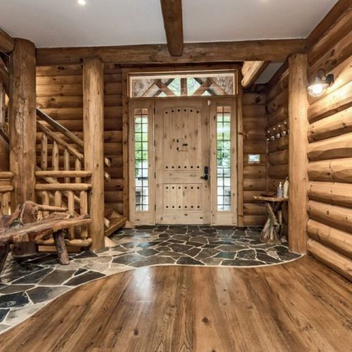 The first view of inside the Chalet is the front entrance.  Stone floor at the entrance and beautiful hardwood floors throughout.