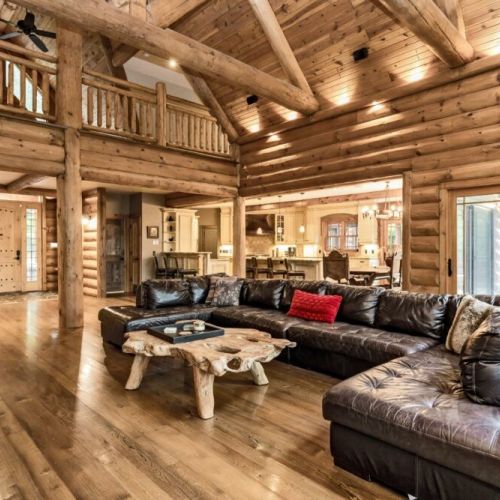 High ceilings and wide open concept between the main living room, dining room and kitchen.  Walk out the door onto the balcony that goes all around the back of the Chalet with fantastic views!