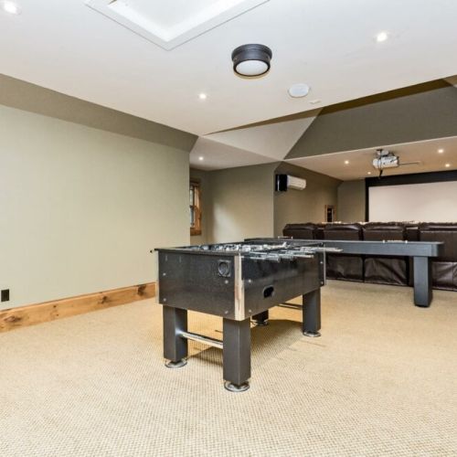 Fully equipped theatre/games room with foosball, shuffleboard, darts, and a huge collection of movies.